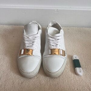 Buscemi white leather with gold accents